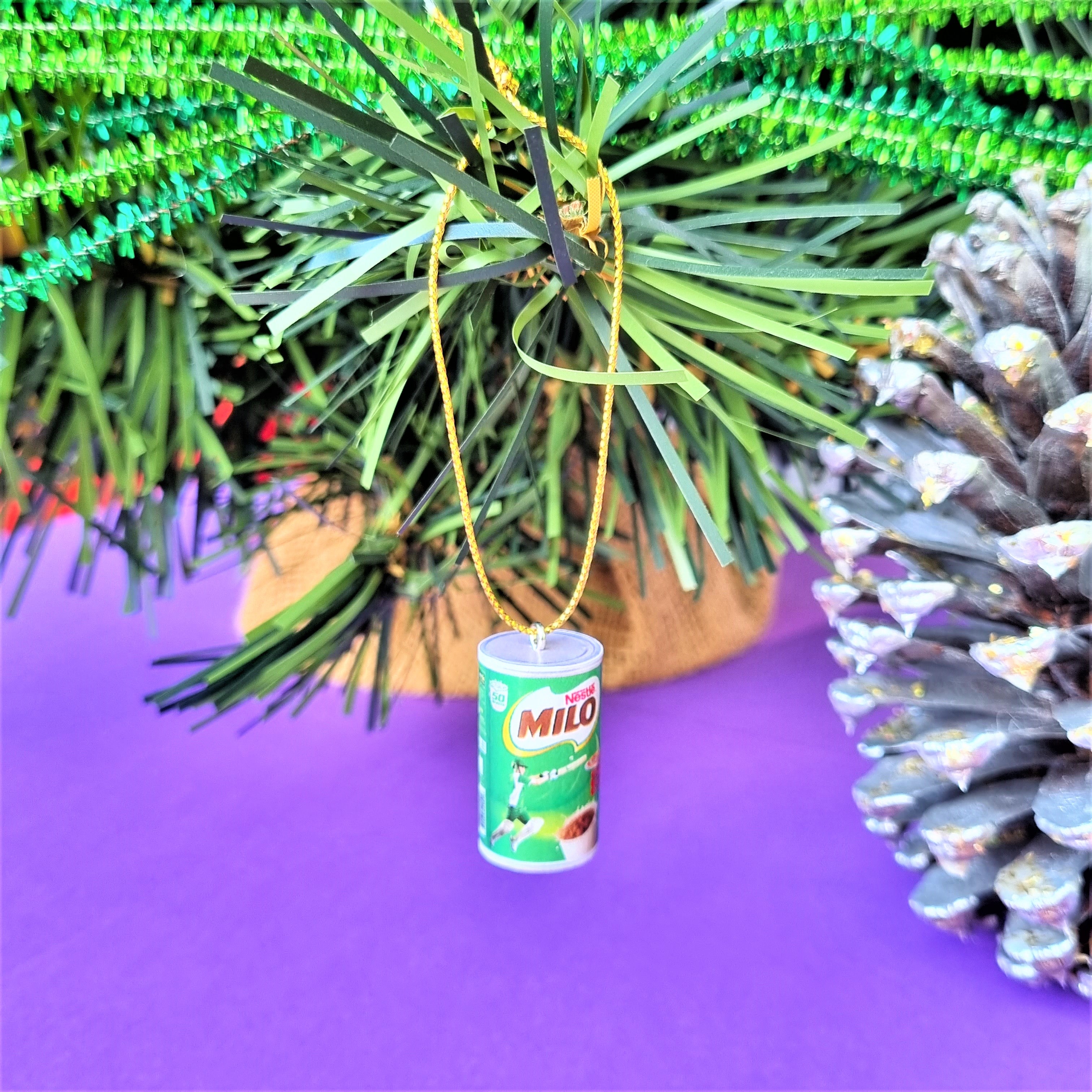 Milo Christmas ornament hanging on a Christmas tree