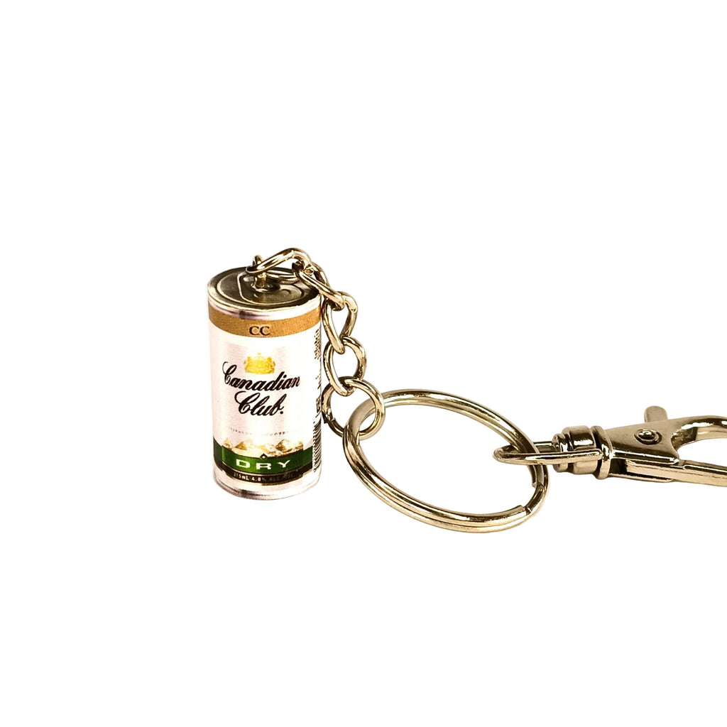 Miniature Canadian Club & Dry can with a silver-toned keychain against a white background