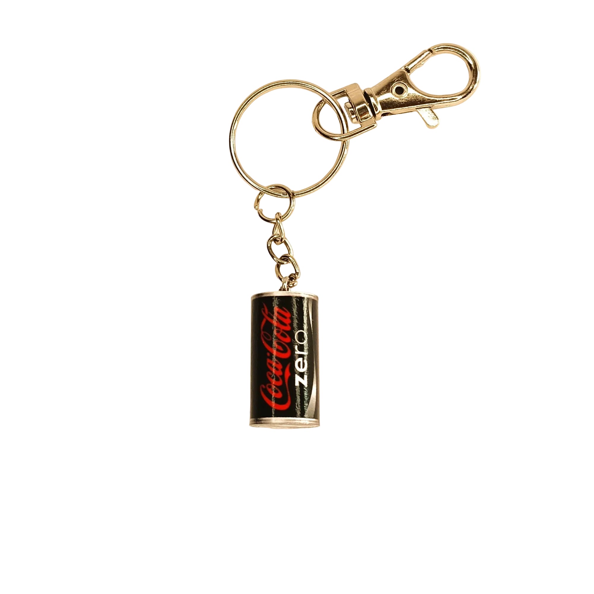 A miniature Coca-Cola Zero keychain featuring a silver metal clasp, split ring, and a small cylindrical charm designed to look like a Coca-Cola Zero can with its signature red and white logo.