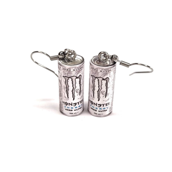 Monster energy drink can earrings on a white background