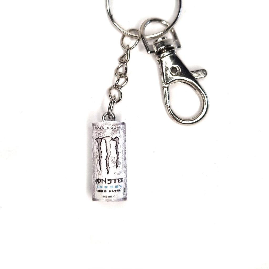 Metal keychain shaped like a Monster Energy drink can on a white background
