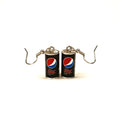 A pair of earrings shaped like miniature Pepsi Max cans, featuring the classic red, white, and blue logo on a black background, with silver-tone hooks attached at the top.