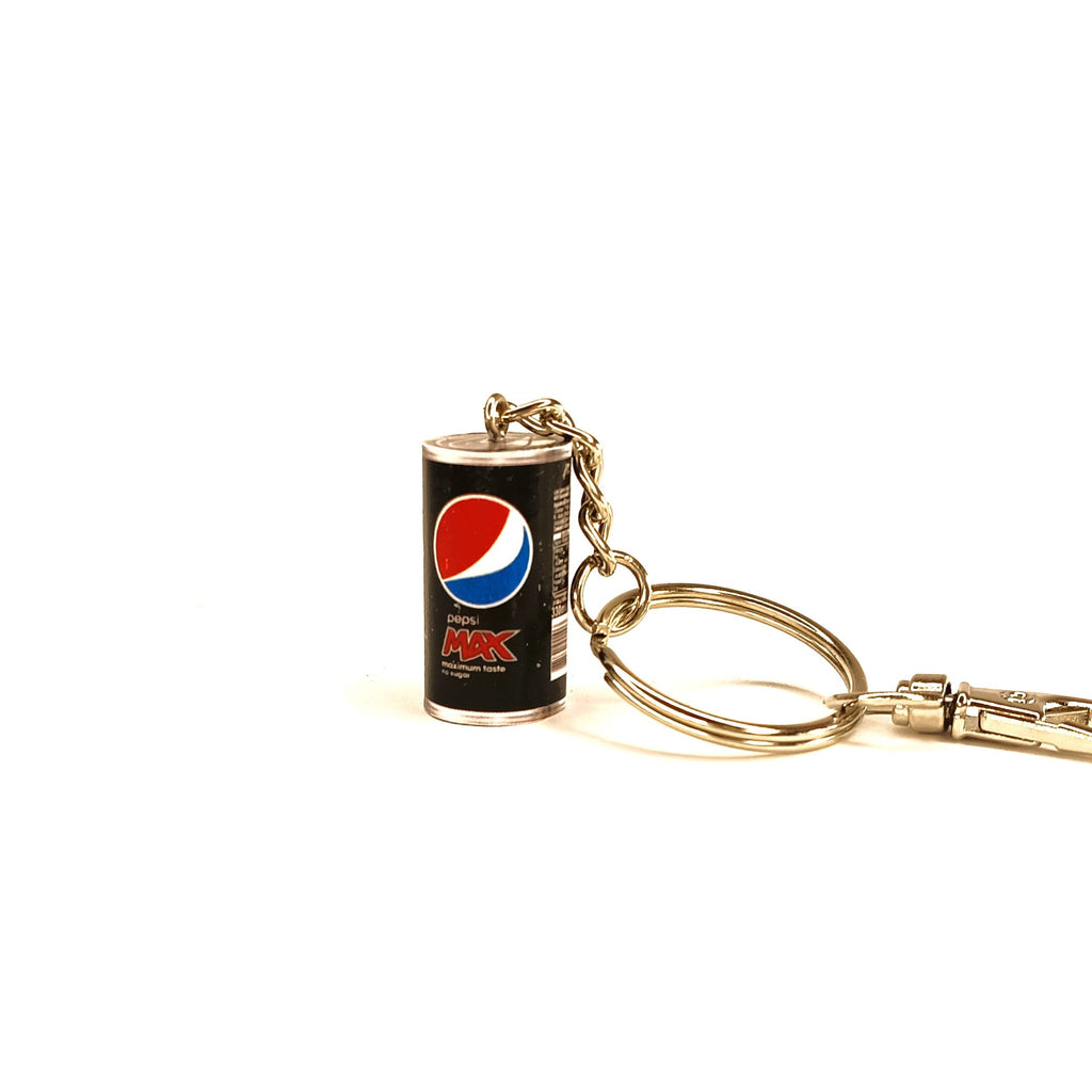 A miniature Pepsi Max keychain featuring a black can-shaped charm with the red, white, and blue Pepsi logo, attached to a gold-tone metal split ring and clasp on a white background.