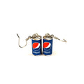 A pair of novelty earrings shaped like miniature Pepsi cans with silver fishhook wires, displayed on a clean white background.