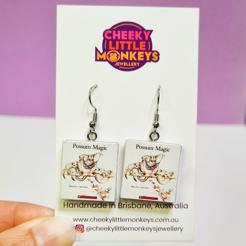 Miniature Possum Magic book earrings on a 'Cheeky Little Monkeys Jewellery' card