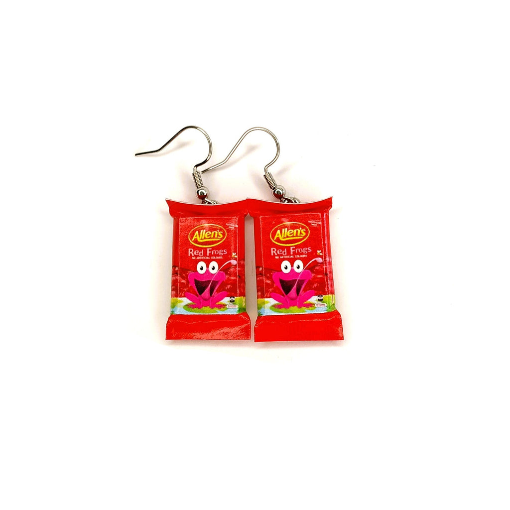 A pair of novelty earrings shaped like Allen's Red Frog lolly packs, hanging from silver fishhook wires on a plain white background.
