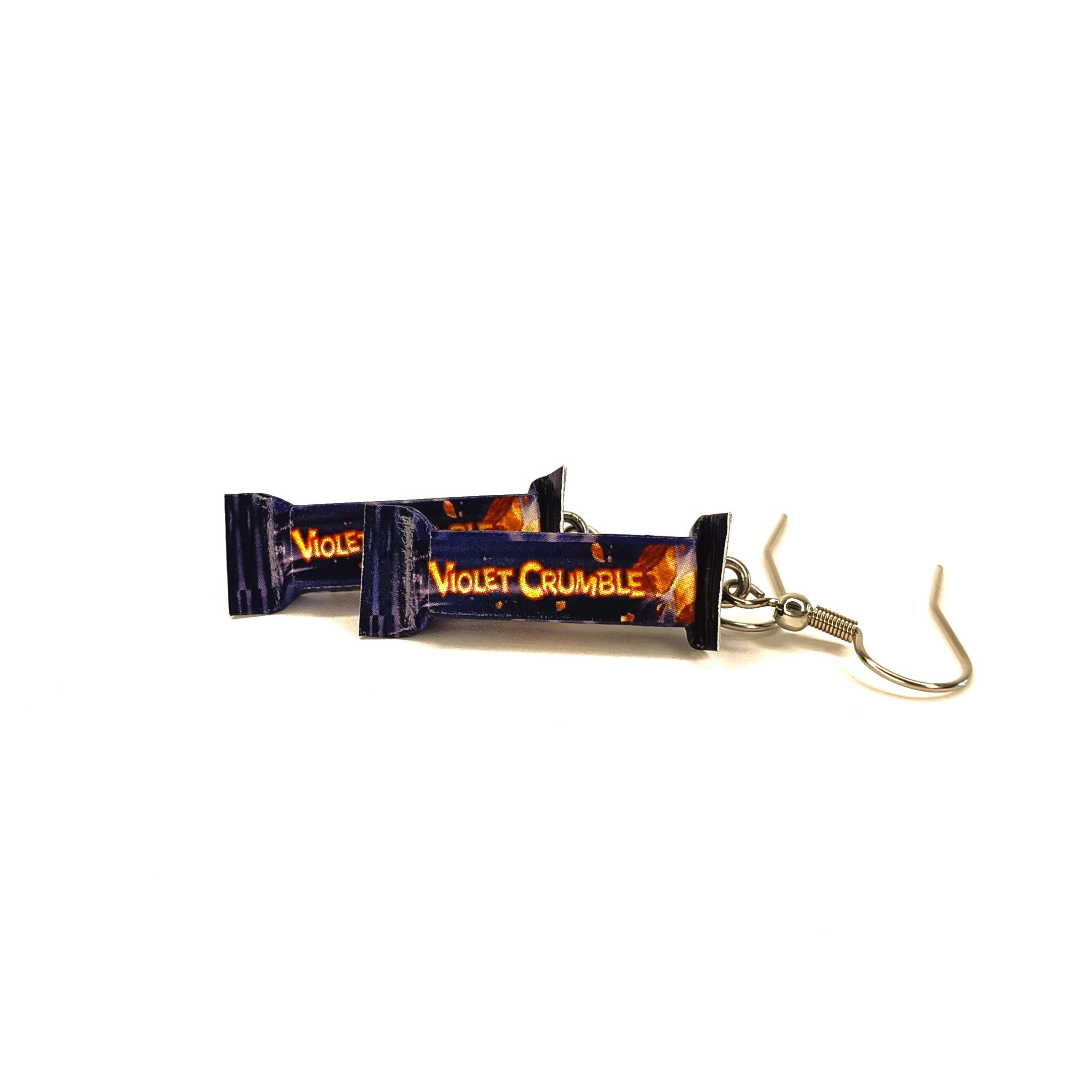 A pair of dangling earrings shaped like Violet Crumble chocolate bars, with orange on a dark purple background with small orange details. The earrings have silver fishhook wires and are displayed on a plain white background.
